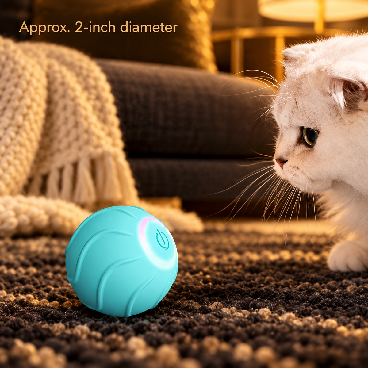 Petchura PLAY blue motion ball beside a cat in a cozy living room, approximately 2-inch diameter
